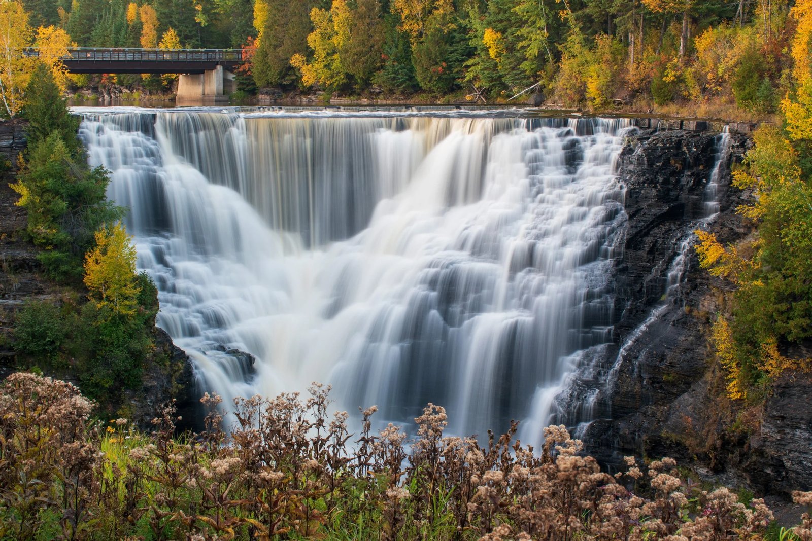Kakabeka Falls framed by autumn trees.