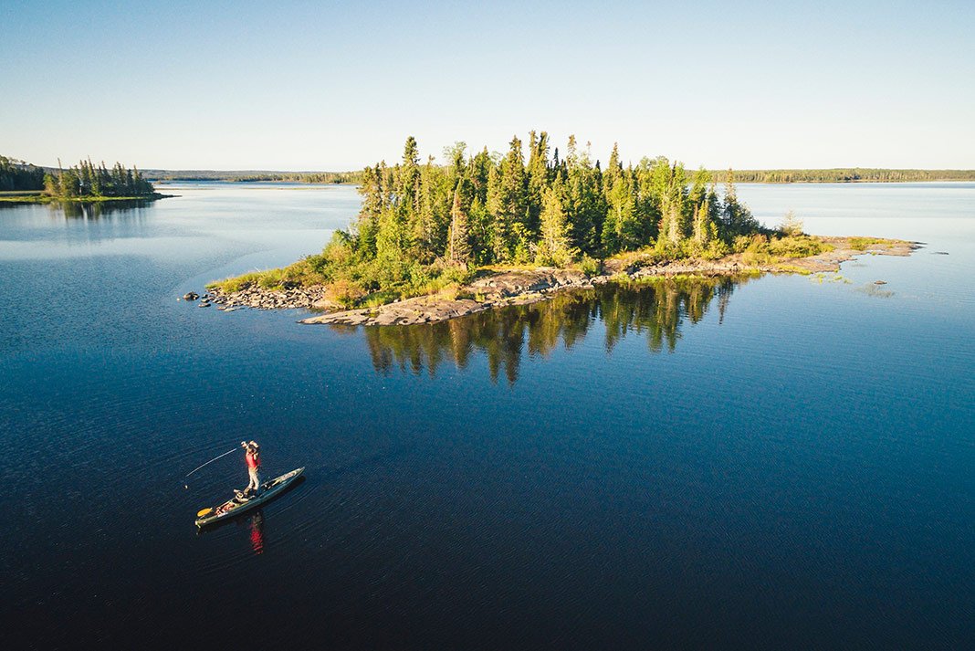 A paddler beside a small island on Lake of the Woods.
